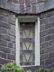 Glas-in-loodraampje originele hoofdingang.
              <br/>
              Corrie Groen- Pickhard, 2015-05-07